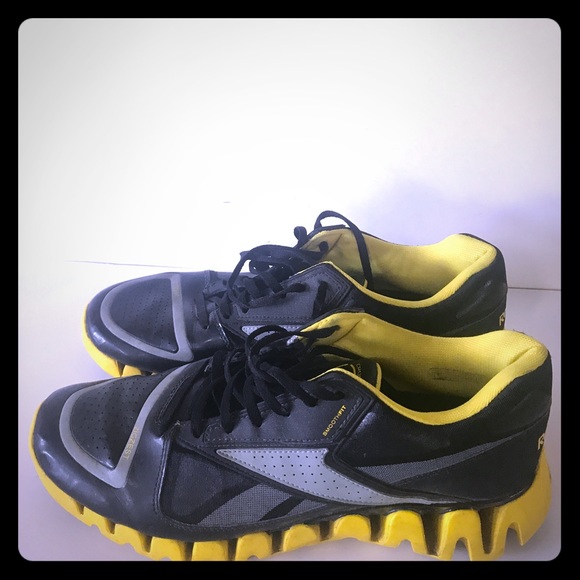 black and yellow reebok shoes
